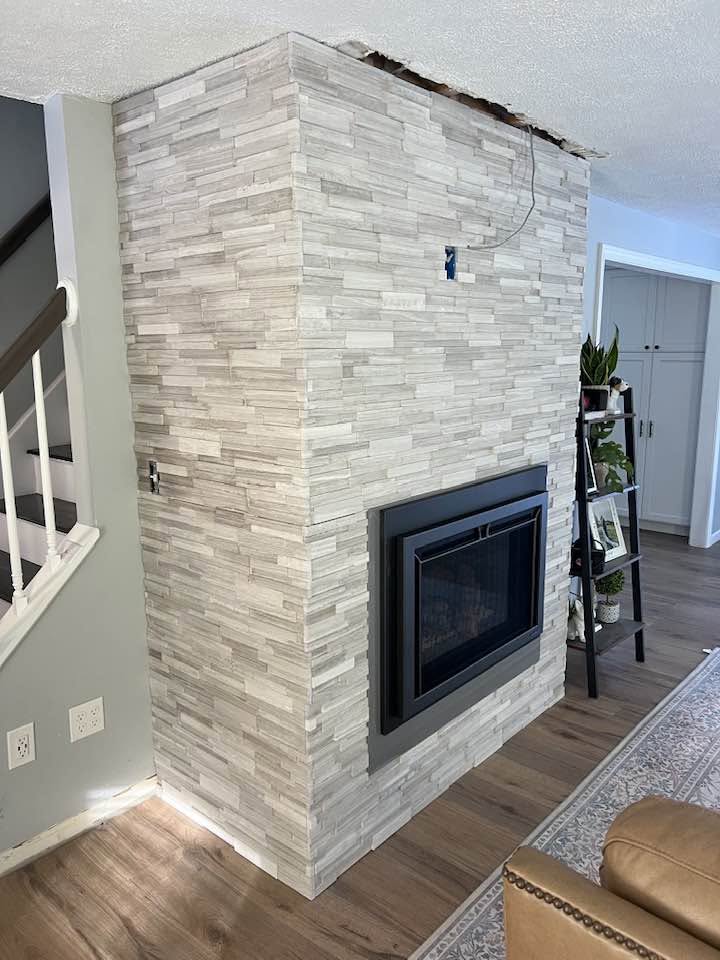 Stacked stone fireplace surround