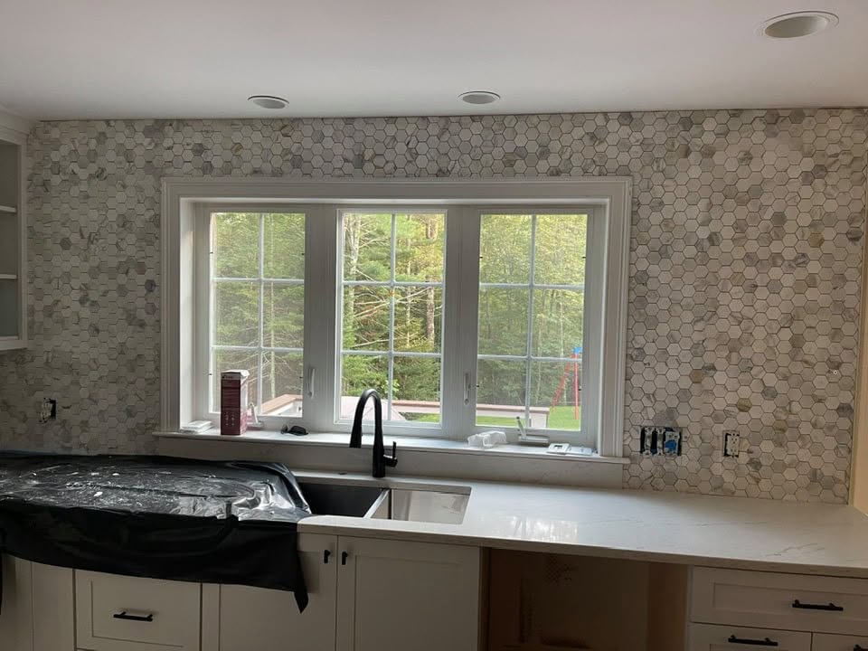 Hexagon marble mosaic kitchen backsplash around window